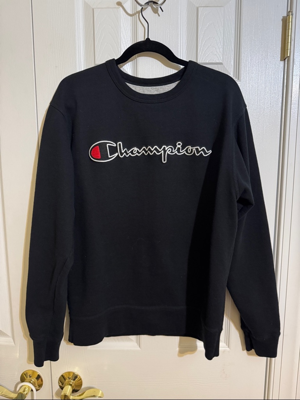 Champion Black Crewneck Sweatshirt with Red Logo Accent
